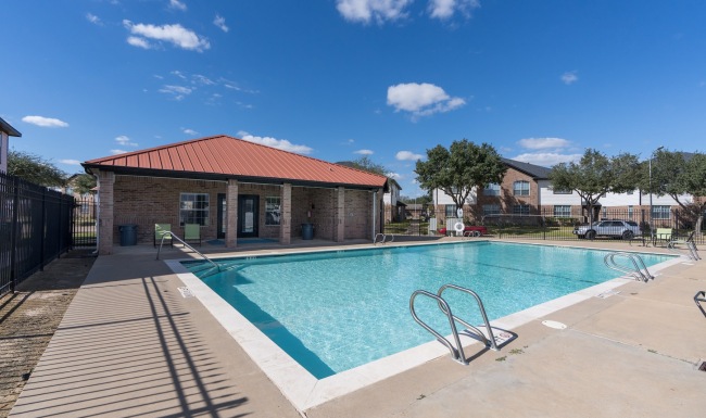 a swimming pool in front of a building